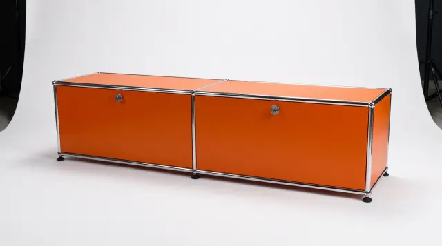 Sideboard in Pure orange (RAL 2004), compatible with USM Haller – 1500 × 350 × 350 mm, 2 compartments, 2 drop-down doors – photorealistic preview