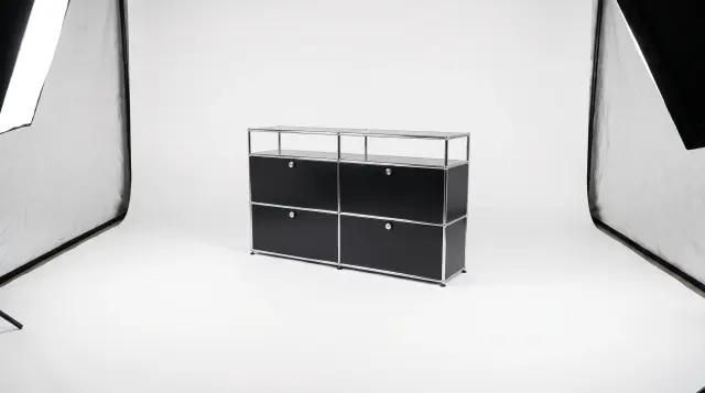 Sideboard in Graphite black (RAL 9011), compatible with USM Haller – 1500 × 875 × 350 mm, 6 compartments, 4 drop-down doors – photorealistic preview